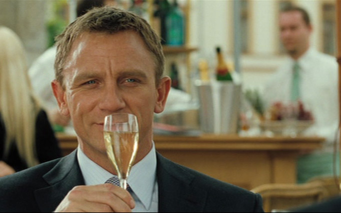 Daniel Craig  James Bond in Casino Royale Montenegro (Grand Hotel Pupp Karlovy Vary Tjeckien) with Champagne Bollinger glass flute with Bollinger logo on the glass.